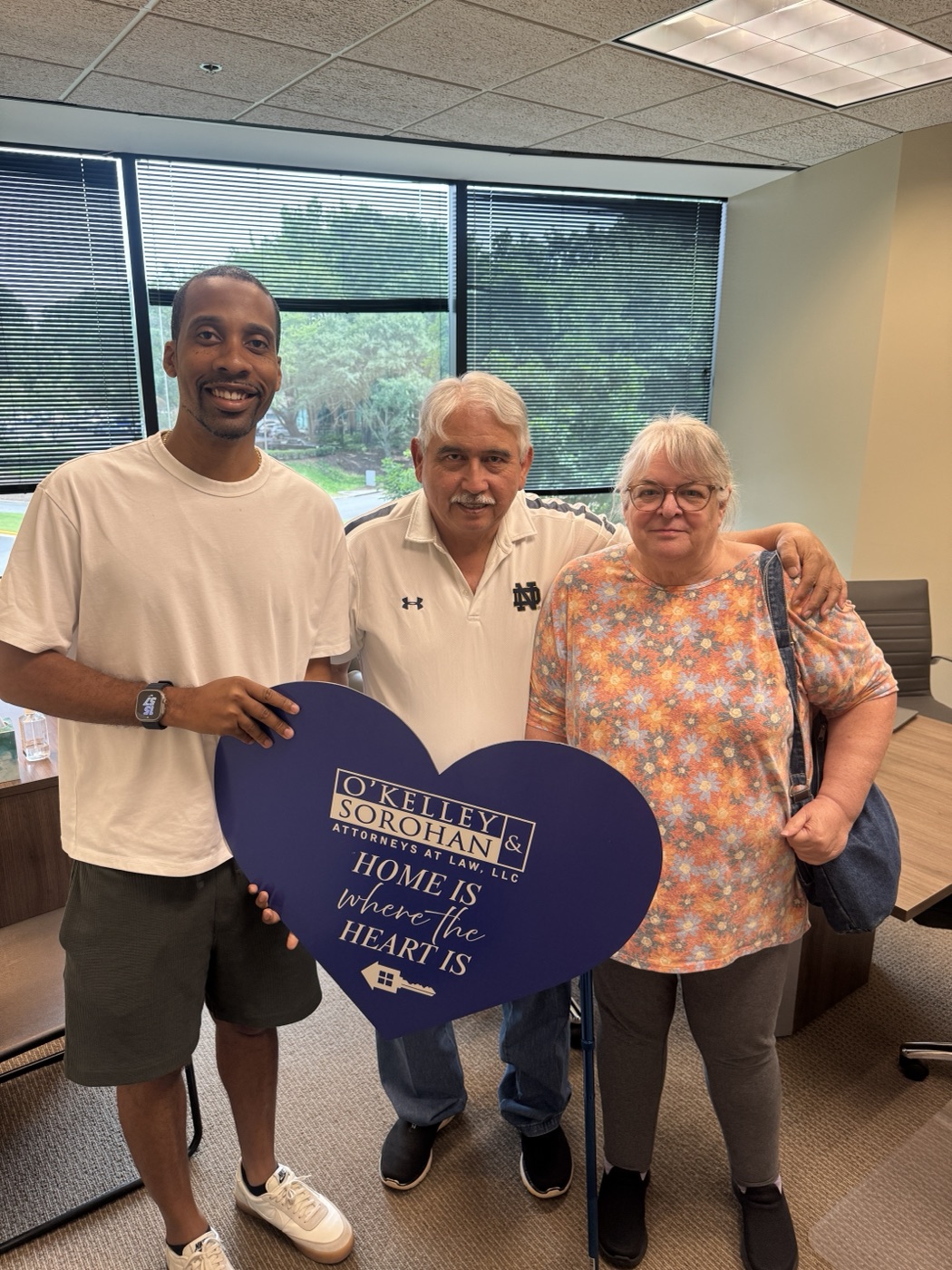 Louis and Robin Melendez with Brandon Barnes at their closing after selling their as-is Atlanta house